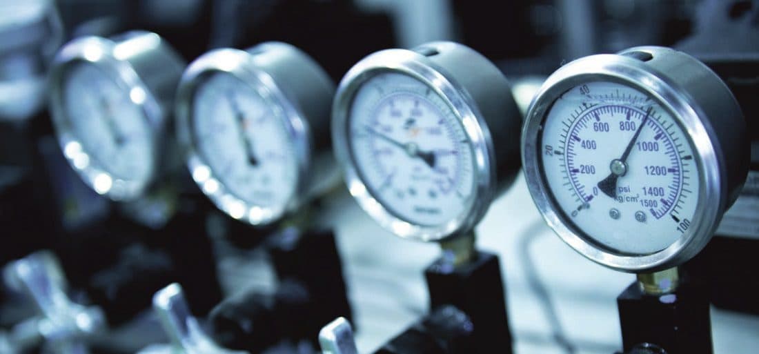 A row of calibrated pressure gauges in the Forza Projects workshop